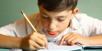 Why do I sometimes bite my tongue while concentrating on things?